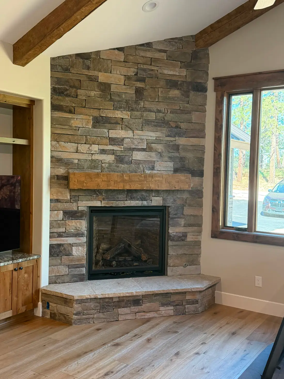 Stacked stone fireplace built by JH Construction